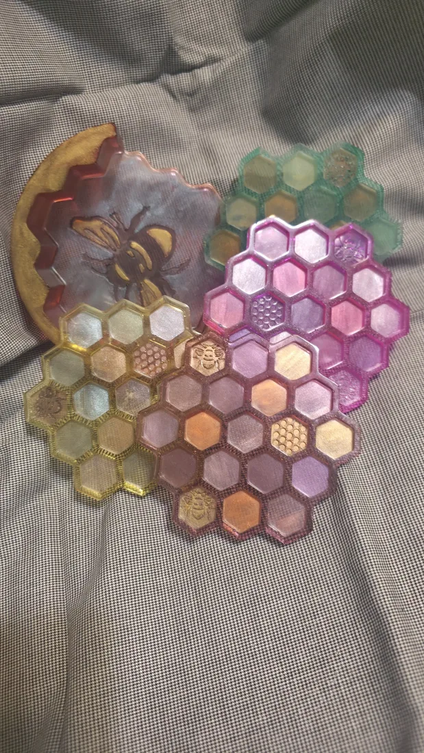 Set of handmade honeycomb-shaped resin trays and a bee coaster
